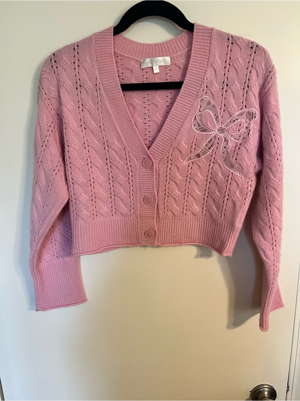 LoveShackFancy pink cardigan with bow, size S.